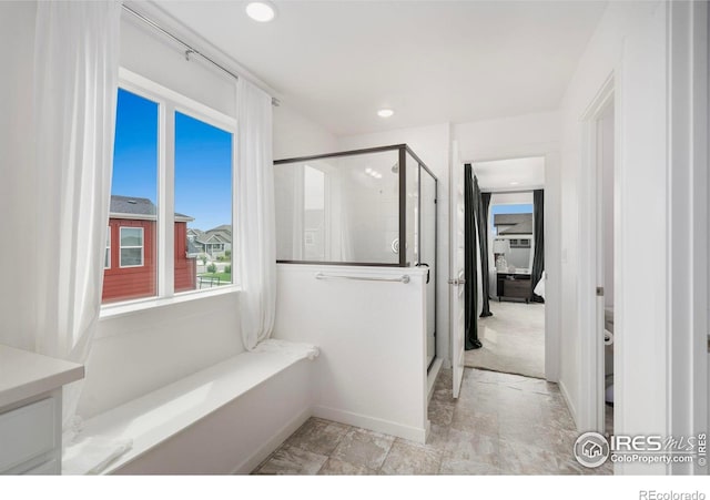 2031 Moon Rise Dr, Windsor, CO 80550 - bathroom with a stall shower, baseboards, vanity, and recessed lighting