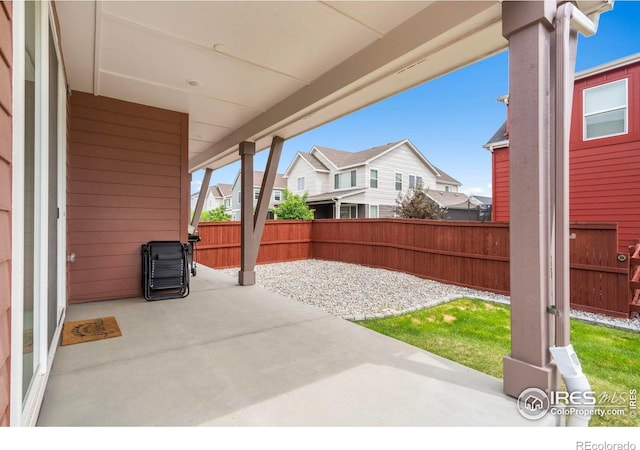 2031 Moon Rise Dr, Windsor, CO 80550 - fenced backyard with a patio and a residential view