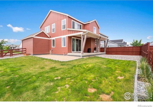 2031 Moon Rise Dr, Windsor, CO 80550 - rear view of property featuring board and batten siding and a patio