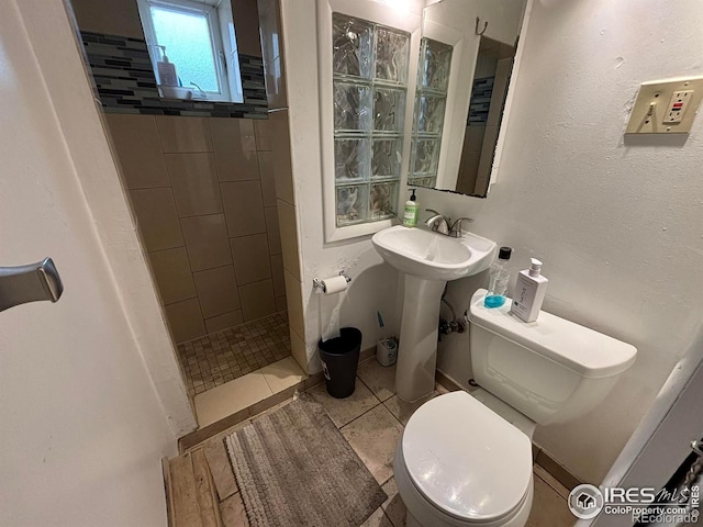 1511 Broadway, Boulder, CO 80302 - full bathroom with walk in shower, toilet, and tile patterned floors