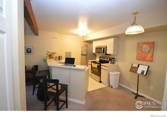30 S Boulder Cir Unit 30182102, Boulder, CO 80303 - kitchen featuring stainless steel appliances, a peninsula, light colored carpet, light countertops, and white cabinetry