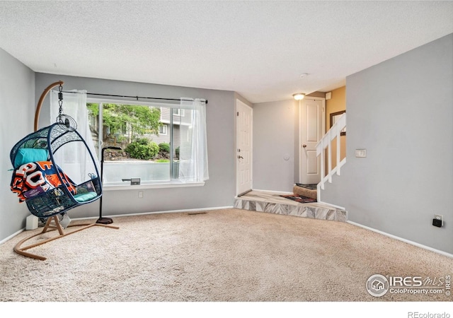 6710 W 84th Way Unit 19, Arvada, CO 80003 - game room with carpet floors, baseboards, and a textured ceiling