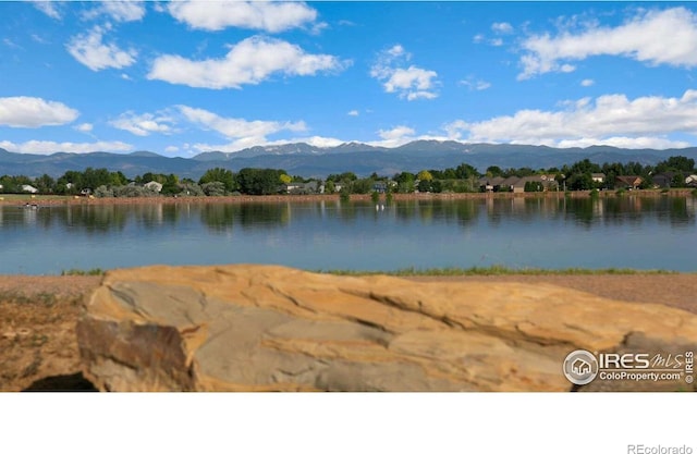 6506 13th St, Frederick, CO 80530 - water view featuring a mountainous background