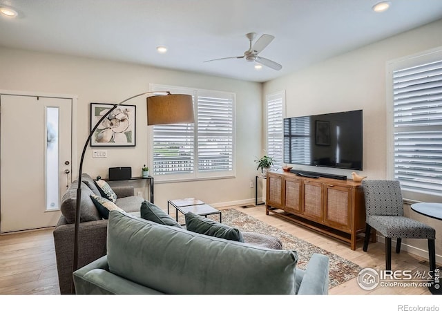 14553 W 91st Dr Unit A, Arvada, CO 80005 - living area with a ceiling fan, light wood finished floors, and recessed lighting