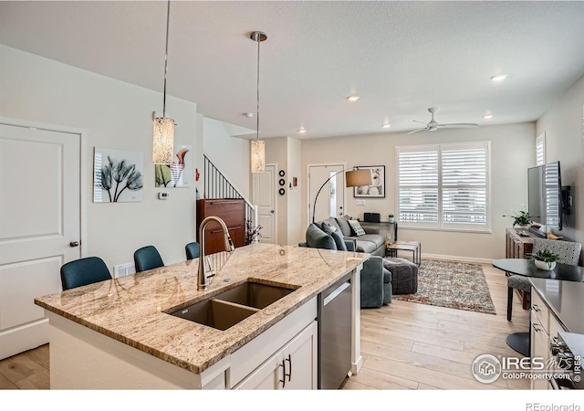 14553 W 91st Dr Unit A, Arvada, CO 80005 - kitchen with a sink, light wood-type flooring, a ceiling fan, dishwasher, and recessed lighting