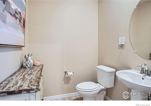 14553 W 91st Dr Unit A, Arvada, CO 80005 - half bathroom with toilet and a sink