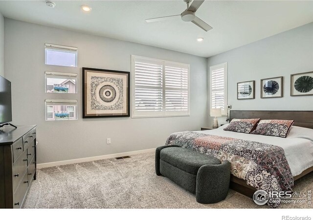 14553 W 91st Dr Unit A, Arvada, CO 80005 - carpeted bedroom featuring baseboards, recessed lighting, and a ceiling fan
