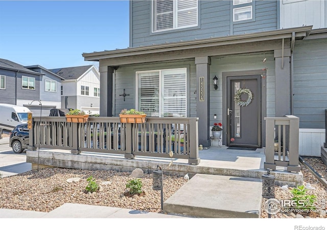 14553 W 91st Dr Unit A, Arvada, CO 80005 - doorway to property featuring covered porch
