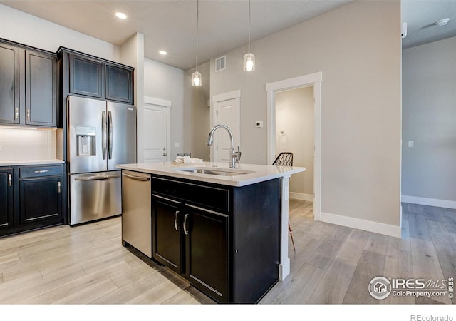 4173 Trapper Lake Dr, Loveland, CO 80538 - kitchen with appliances with stainless steel finishes, a sink, light wood-type flooring, light countertops, and recessed lighting