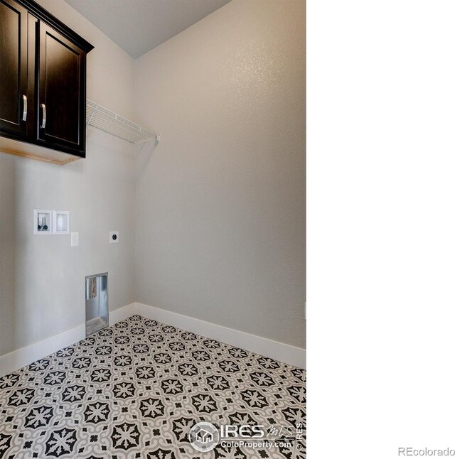 4173 Trapper Lake Dr, Loveland, CO 80538 - laundry area with electric dryer hookup, cabinet space, baseboards, and washer hookup
