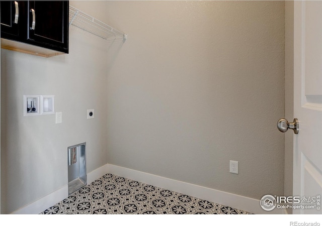 4173 Trapper Lake Dr, Loveland, CO 80538 - laundry area featuring hookup for a washing machine, cabinet space, hookup for an electric dryer, and baseboards