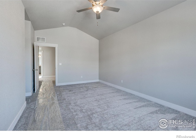 4173 Trapper Lake Dr, Loveland, CO 80538 - carpeted empty room featuring ceiling fan, vaulted ceiling, and baseboards