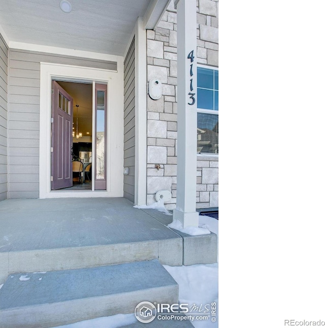 4173 Trapper Lake Dr, Loveland, CO 80538 - property entrance featuring stone siding