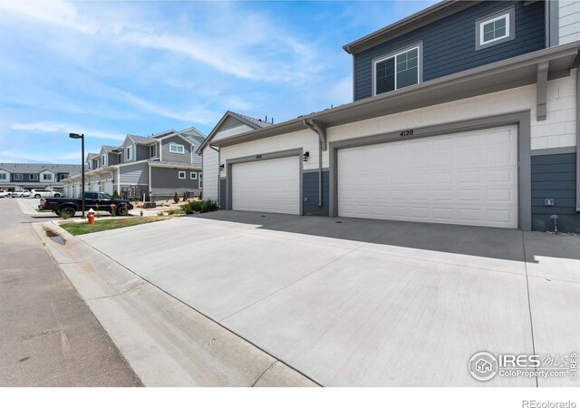 4173 Trapper Lake Dr, Loveland, CO 80538 - view of front of home with a residential view, driveway, and a garage
