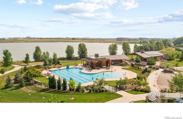 4173 Trapper Lake Dr, Loveland, CO 80538 - view of pool with a water view and a patio area