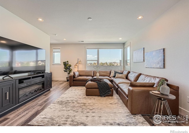 2446 W 167th Ln, Broomfield, CO 80023 - living area with wood finished floors, baseboards, and recessed lighting
