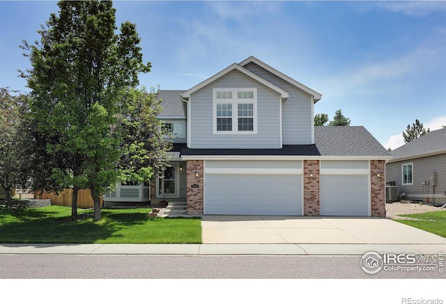 5603 Pierson Mountain Ave, Longmont, CO 80503 - traditional-style house featuring brick siding, concrete driveway, a front yard, and a garage