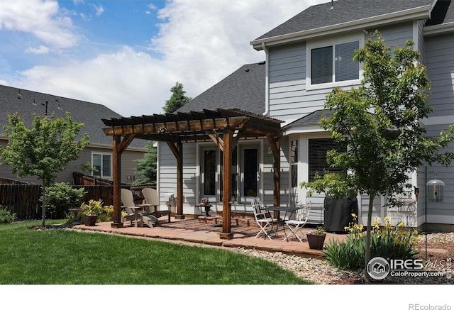 5603 Pierson Mountain Ave, Longmont, CO 80503 - rear view of house featuring a pergola, a patio area, and roof with shingles