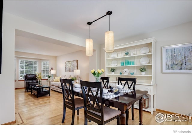 5603 Pierson Mountain Ave, Longmont, CO 80503 - dining area with light wood-type flooring and baseboards