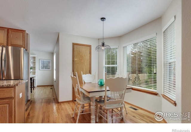 5603 Pierson Mountain Ave, Longmont, CO 80503 - dining space with light wood-type flooring and baseboards