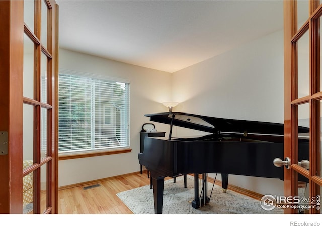 5603 Pierson Mountain Ave, Longmont, CO 80503 - living area featuring wood finished floors and baseboards