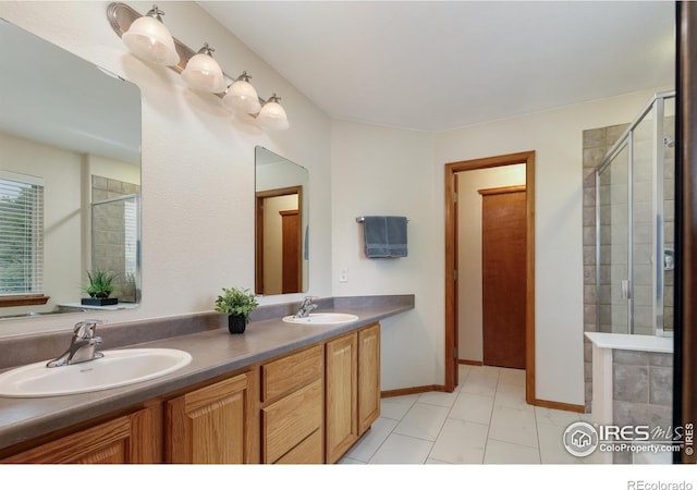 5603 Pierson Mountain Ave, Longmont, CO 80503 - full bathroom with double vanity, a shower stall, baseboards, and marble finish floors