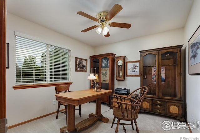 5603 Pierson Mountain Ave, Longmont, CO 80503 - office area with light colored carpet, a ceiling fan, and baseboards