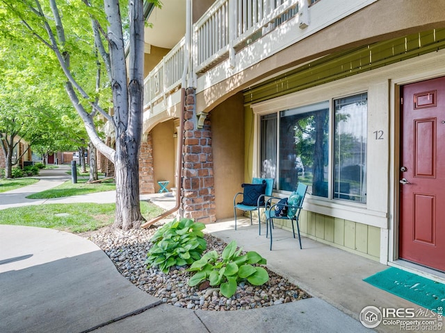 4800 Osage Dr Unit 12B, Boulder, CO 80303 - view of exterior entry featuring stucco siding and covered porch