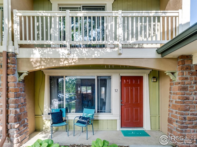 4800 Osage Dr Unit 12B, Boulder, CO 80303 - doorway to property featuring a balcony and brick siding