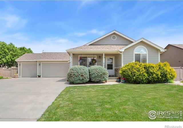8768 Indian Village Dr, Wellington, CO 80549 - ranch-style home featuring driveway, an attached garage, a porch, and roof with shingles