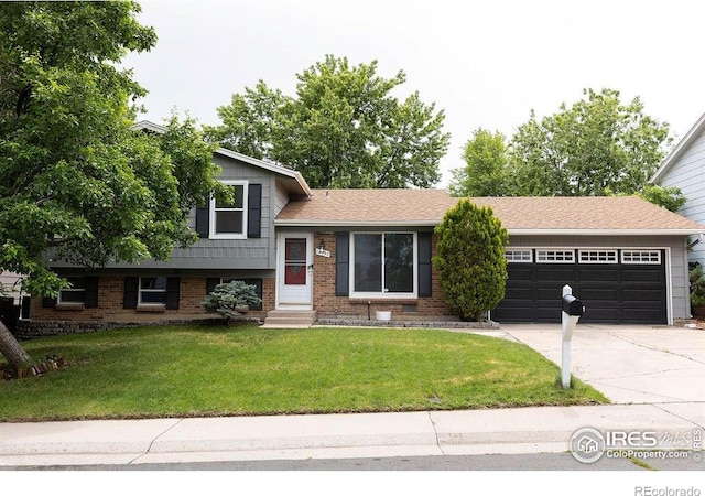 15532 E Pacific Pl, Aurora, CO 80013 - tri-level home with a garage, concrete driveway, a front lawn, brick siding, and entry steps