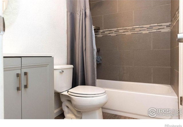 15532 E Pacific Pl, Aurora, CO 80013 - bathroom featuring toilet and shower / bathtub combination with curtain