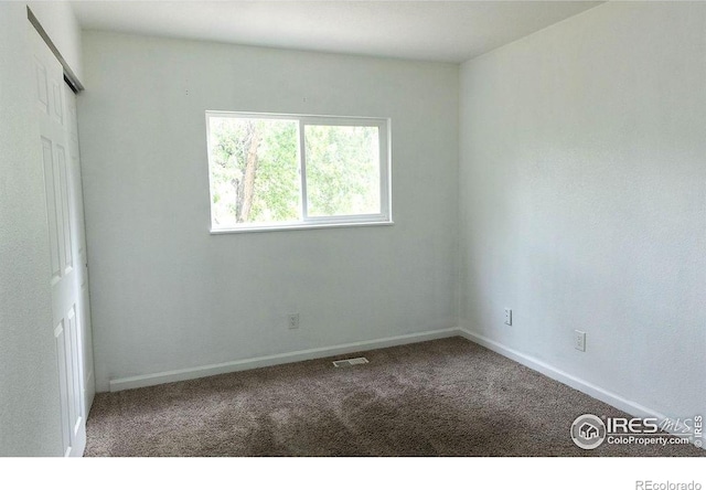 15532 E Pacific Pl, Aurora, CO 80013 - unfurnished bedroom with carpet floors, baseboards, and a closet