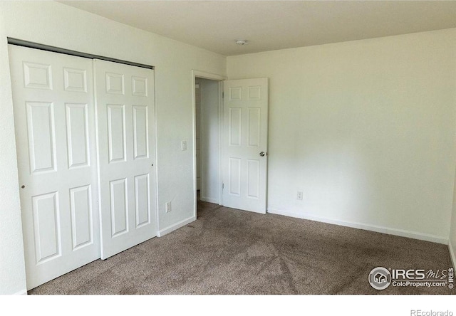 15532 E Pacific Pl, Aurora, CO 80013 - unfurnished bedroom featuring carpet floors, a closet, and baseboards