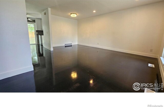 15532 E Pacific Pl, Aurora, CO 80013 - spare room featuring baseboards and recessed lighting