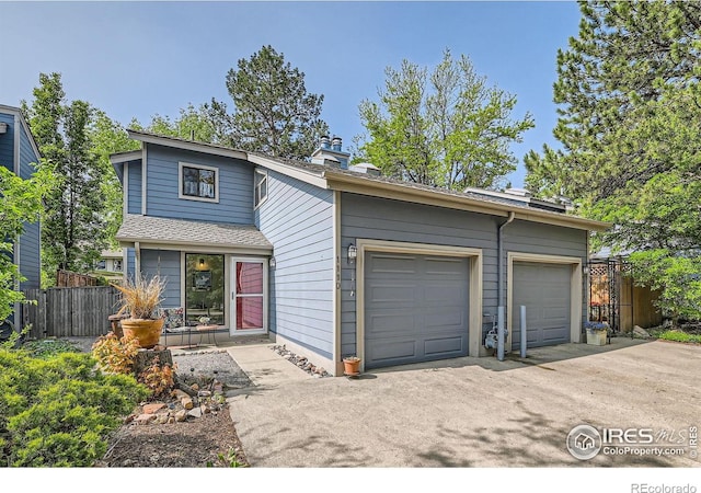 1110 Poplar Ave, Boulder, CO 80304 - mid-century inspired home with a garage, a chimney, and driveway
