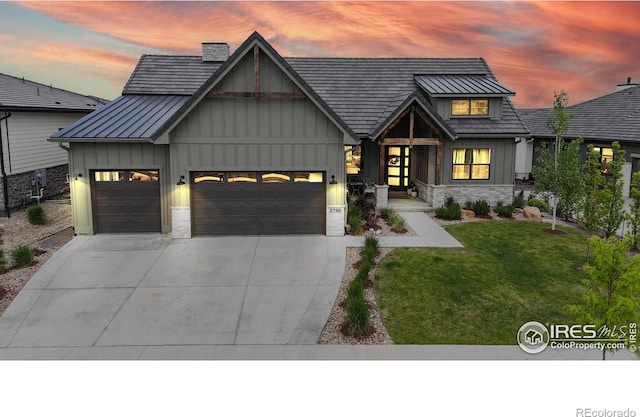 2790 Heron Lakes Pkwy, Berthoud, CO 80513 - modern farmhouse style home featuring a garage, board and batten siding, stone siding, concrete driveway, and a front yard