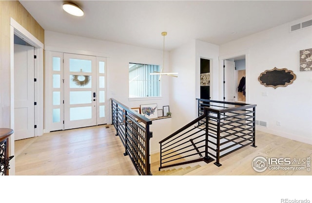 2790 Heron Lakes Pkwy, Berthoud, CO 80513 - entrance foyer featuring wood finished floors and baseboards
