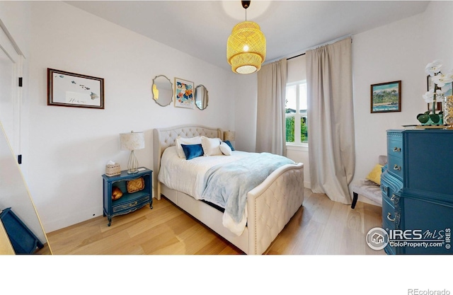2790 Heron Lakes Pkwy, Berthoud, CO 80513 - bedroom featuring light wood-type flooring