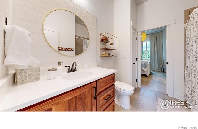 2790 Heron Lakes Pkwy, Berthoud, CO 80513 - full bathroom featuring vanity, tile patterned flooring, toilet, connected bathroom, and a shower with curtain