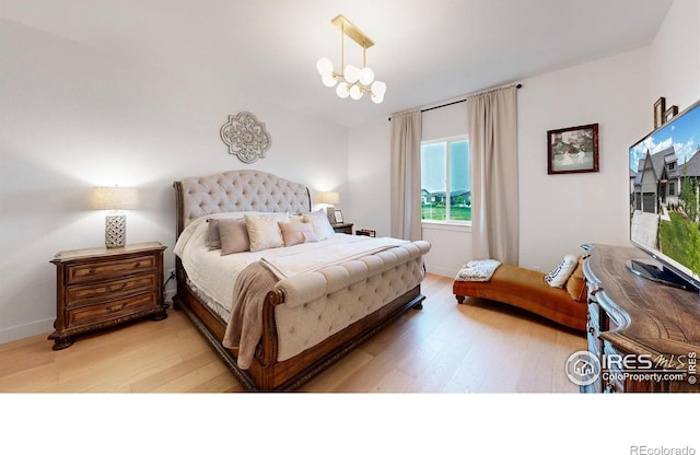 2790 Heron Lakes Pkwy, Berthoud, CO 80513 - bedroom featuring light wood-style flooring and baseboards