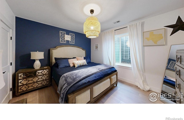 2790 Heron Lakes Pkwy, Berthoud, CO 80513 - bedroom with wood finished floors and baseboards