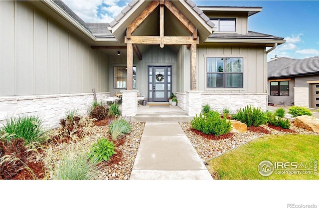 2790 Heron Lakes Pkwy, Berthoud, CO 80513 - entrance to property featuring stone siding and board and batten siding