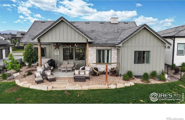 2790 Heron Lakes Pkwy, Berthoud, CO 80513 - rear view of property featuring board and batten siding, outdoor lounge area, a patio area, and a ceiling fan