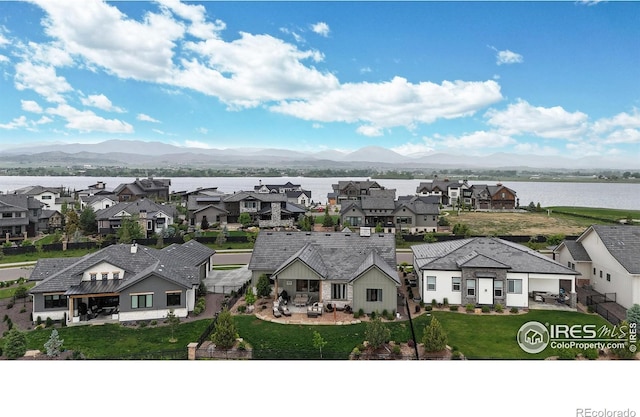 2790 Heron Lakes Pkwy, Berthoud, CO 80513 - aerial perspective of suburban area with a water and mountain view