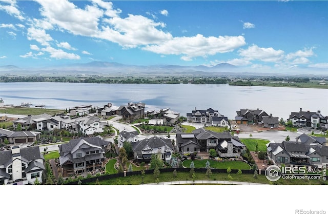 2790 Heron Lakes Pkwy, Berthoud, CO 80513 - aerial view of residential area featuring a water and mountain view