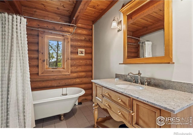 172 Tall Pine Ln, Boulder, CO 80302 - bathroom featuring rustic walls, wooden ceiling with exposed beams, vanity, a freestanding tub, and tile patterned floors