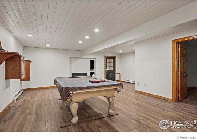 172 Tall Pine Ln, Boulder, CO 80302 - recreation room with a baseboard radiator, recessed lighting, wood finished floors, baseboards, and wood ceiling