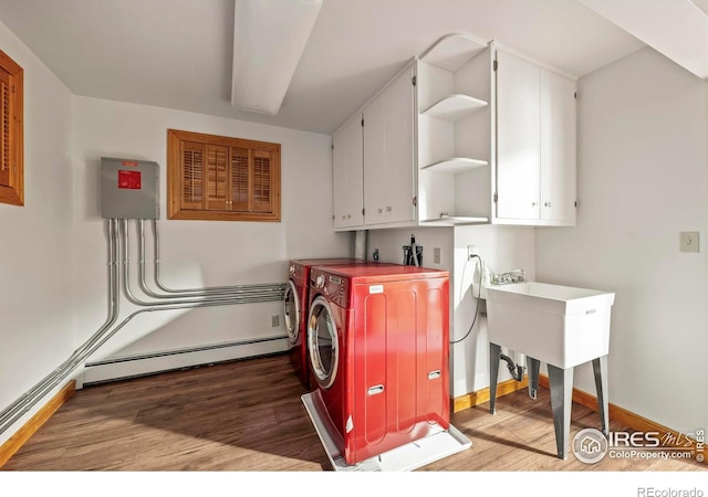 172 Tall Pine Ln, Boulder, CO 80302 - laundry room featuring cabinet space, wood finished floors, washer and clothes dryer, and baseboards