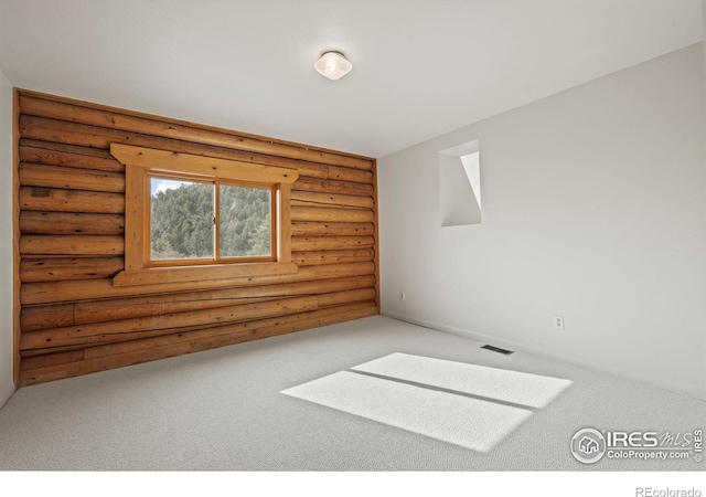 172 Tall Pine Ln, Boulder, CO 80302 - carpeted spare room featuring rustic walls